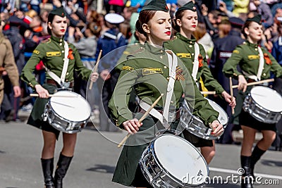 Russia, Vladivostok, 05/09/2018. Nice ladies drummers in stylish military uniform on annual parade on Victory Day on May`9. Editorial Stock Photo