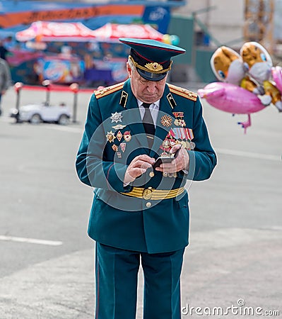 Russia, Vladivostok, 05/09/2018. Old officer in parade military uniform, veteran and hero of Great Patriotic War between USSR and Editorial Stock Photo