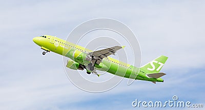 Passenger jet aircraft Airbus A320 of S7 Airlines in a blue sky. Aviation and transportation Editorial Stock Photo