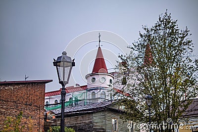 Russia, Vyborg - October 15, 2023: Vintage lantern against the background of a house with a spire in the old town Editorial Stock Photo