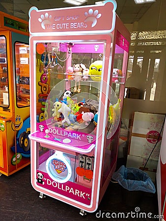 Russia Yaroslavl 21.02.2021 Pink slot machine with toys prizes in the children`s center Editorial Stock Photo