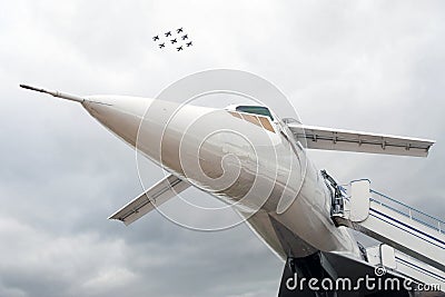 Russian airplane TU-144 and eight planes in sky Stock Photo