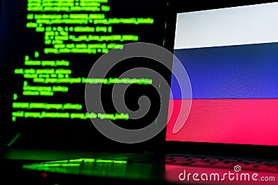 Russian anonymous hackers. Russian flag and programming code in background Stock Photo