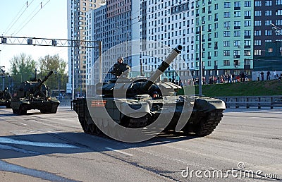 The Russian average main T-72B3 tank the `Pokrovsk` modification goes around the city. Editorial Stock Photo