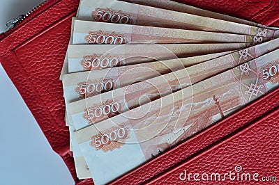 Russian banknotes 5000 rubles in red women wallet Stock Photo