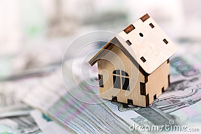 Russian banknotes rubles under wooden house Stock Photo