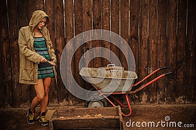Russian beauty blonde with blue eyes working on the farm. The concept of Russian beauty Stock Photo