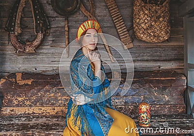Russian beauty closeup on the traditional background with different things for life Stock Photo