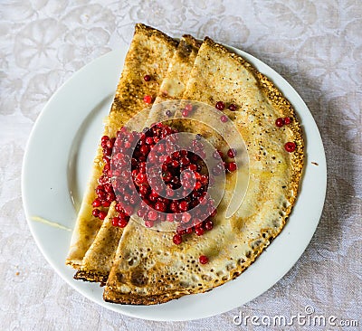 Russian blini with lingonberries Stock Photo