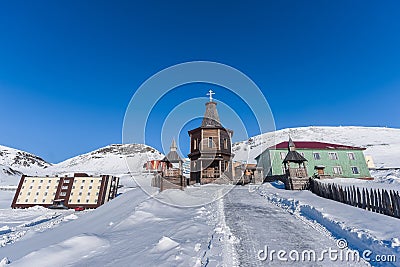 Russian city of Barentsburg on the Spitsbergen archipelago in the winter in the Arctic In sunny weather and blue sky Editorial Stock Photo
