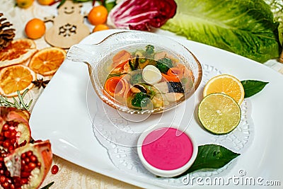 Russian dish aspic with sauce served on the table Stock Photo
