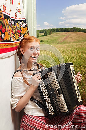 Russian girl playing the accordion Stock Photo