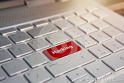 Russian hacker hacking the server. Color button on the gray silver keyboard of modern ultrabook. caption on the button Stock Photo