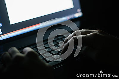 Russian hacker hacking the server in the dark Stock Photo