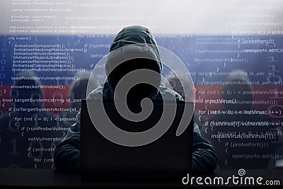 Russian hacker at laptop. Malware and virus Stock Photo