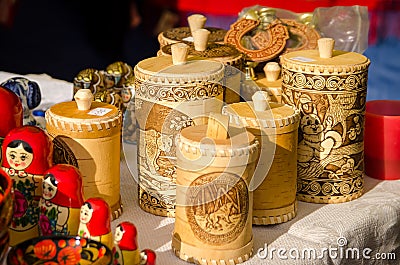 Russian home-made various souvenirs on sale at a city fair. Container of birch bark Editorial Stock Photo