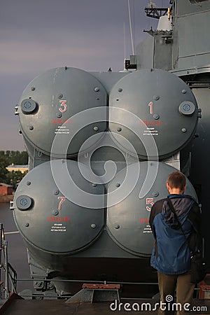 A man stands before the four-way launcher of anti-ship cruise missiles P-270 Moskit Editorial Stock Photo