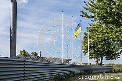 The Russian oligarch Vladimir Lisin hoists the Ukrainian flag over his steelworks in FrederiksvÃ¦rk Stock Photo