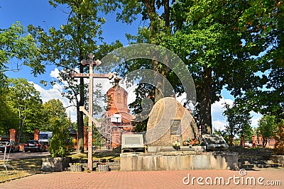 Russian orthodox church with stone monument and cross Editorial Stock Photo