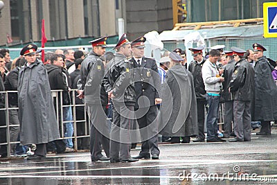 The Russian police during a rain, near procession of communists Editorial Stock Photo