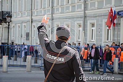 Russian policeman officer standing back to camera with inscription Police on the uniform jacket Editorial Stock Photo