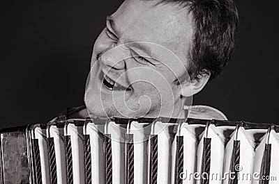 Russian poor man with an accordion Stock Photo