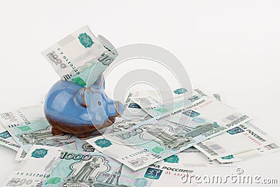 Russian rubles and piggy bank, on white Stock Photo