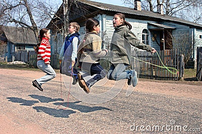 Russian, rural schoolchildren during recess, jumping rope Editorial Stock Photo