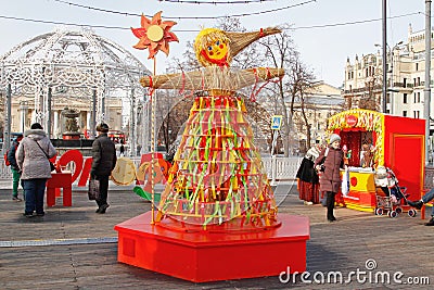 Russian Shrovetide doll made of straw and decorated with ribbons at Russian national festival `Shrove` in Moscow Editorial Stock Photo