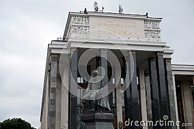 Russian State Library and a monument to Fyodor Dostoyevsky. Editorial Stock Photo