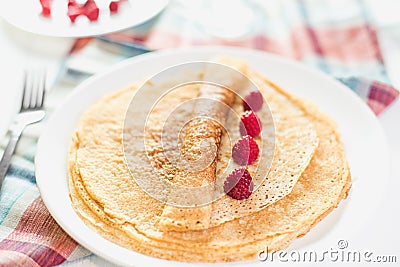 Russian thin pancake with raspberries Stock Photo