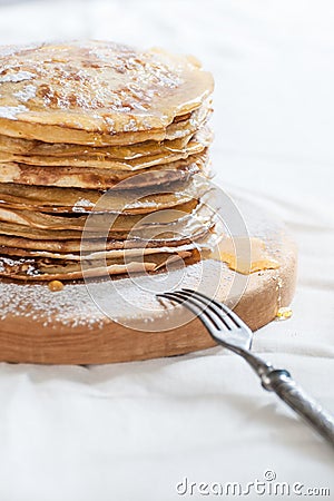 Russian traditional dish - pancakes with honey. Stock Photo