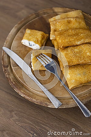 Russian traditional pancakes or blini with cottage cheese Stock Photo