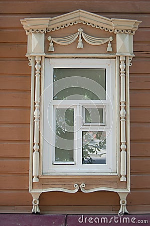 Russian wooden window in Tomsk, Russia. Old house. Historic building. Stock Photo
