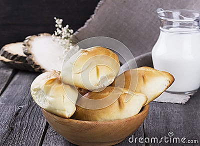 Russians traditional pastries - pies on a dark wooden background Stock Photo