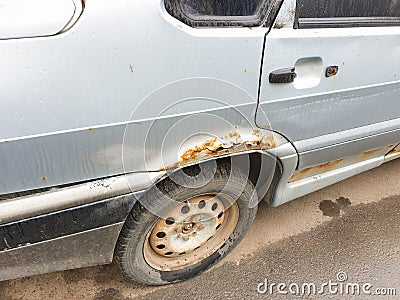Rust on the car body, cosmetic car repair from rust, metal corrosion Stock Photo