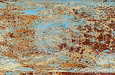 Rust and damaged blue and yellow paint on metal sheet Stock Photo