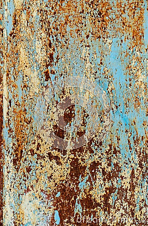 Rust and damaged blue and yellow paint on metal sheet Stock Photo