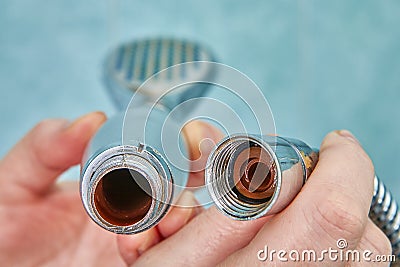 Rust inside old shower head and on hose Stock Photo