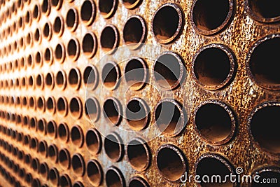 Rust tube sheet of the heat exchanger for maintenance, the water heater in the boiler as background wirh light Stock Photo