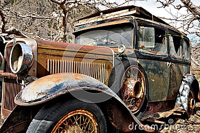 Rusted abandoned antique car Stock Photo