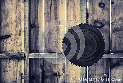 Rusted Circular Saw Blades on a Wooden Wall - Retro Stock Photo