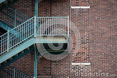 Rusted metal exterior stairway and brick wall in Rock Hill, SC Stock Photo