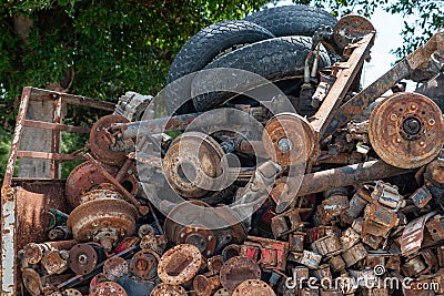 Rusted Old car parts and tyres Stock Photo