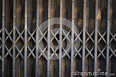 Rusted vintage folding old metal door gate background Stock Photo