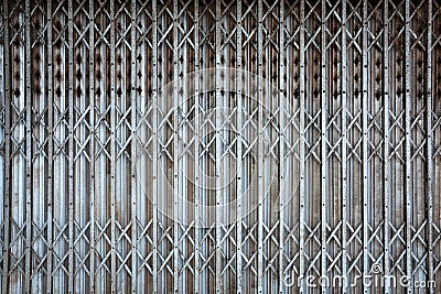 Rusted vintage folding old metal door gate background texture Stock Photo