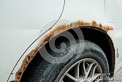 Rusted wheel arch at car. car corrosion Stock Photo