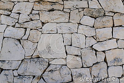 Rustic ancient handcraft tile stack stone wall as background in Stock Photo