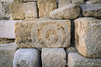 Rustic ancient handcrafted stack stone wall in Matera, italy Stock Photo