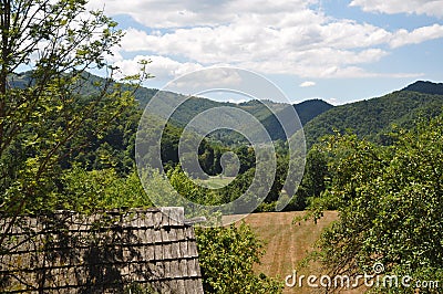 Rustic architectural detail with mountain on the background Stock Photo